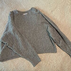 Cropped cable knit sweater